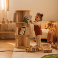 toddler choosing a book from a rotating book shelf