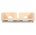 A light natural wood modular play couch or bench made of plywood, featuring two raised backrests with circular cutouts and short legs, shown on a plain white background.