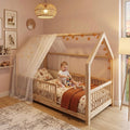 Child in a wooden house Montessori floor bed with canopy in a nursery room