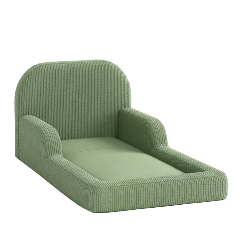 Green upholstered toddler floor bed on a white background